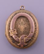 A Victorian unmarked gold locket. 2.75 x 2.5 cm.