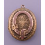 A Victorian unmarked gold locket. 2.75 x 2.5 cm.