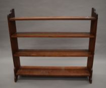 A Victorian mahogany open bookcase. 115 cm wide.
