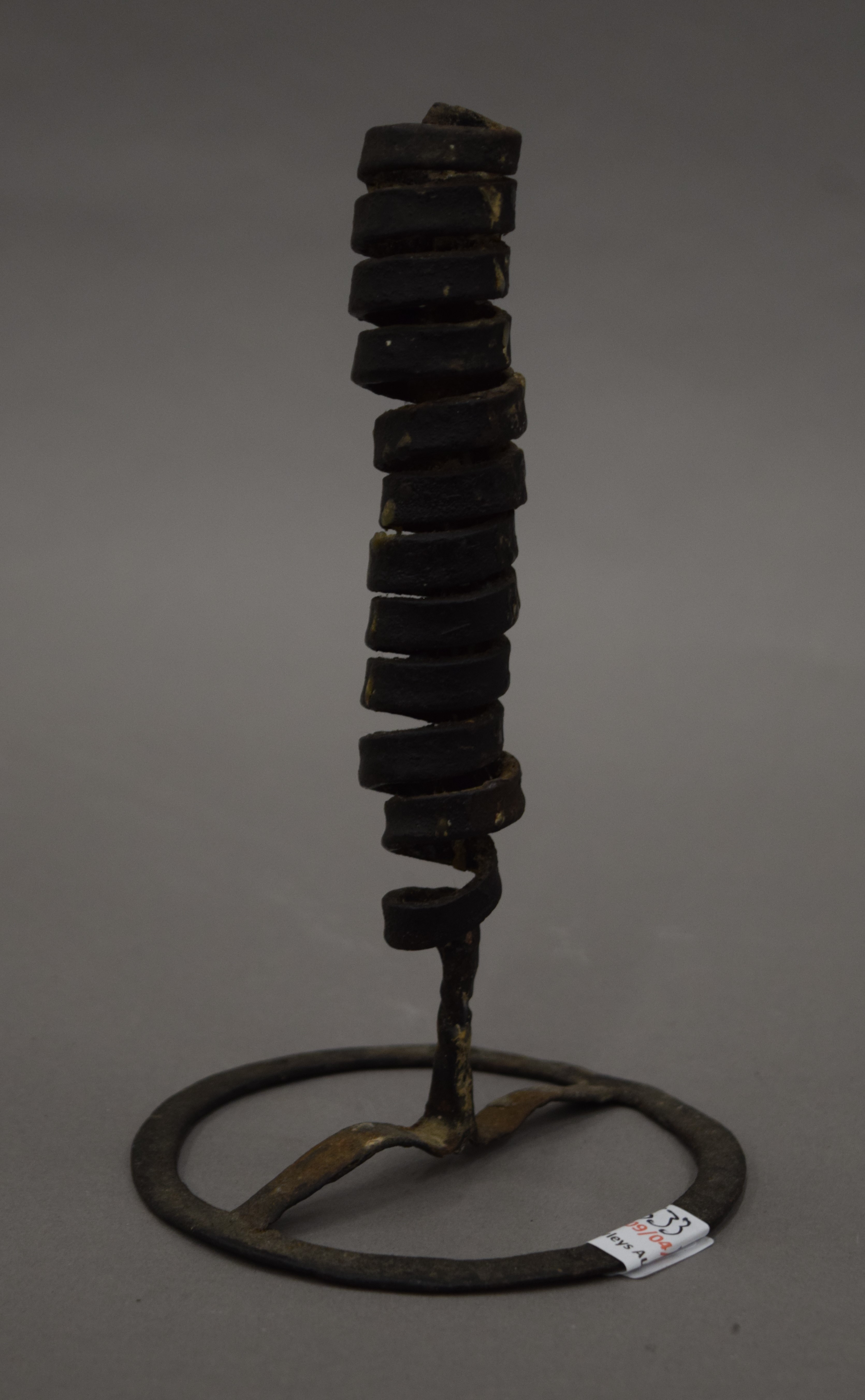 An early iron candlestick.