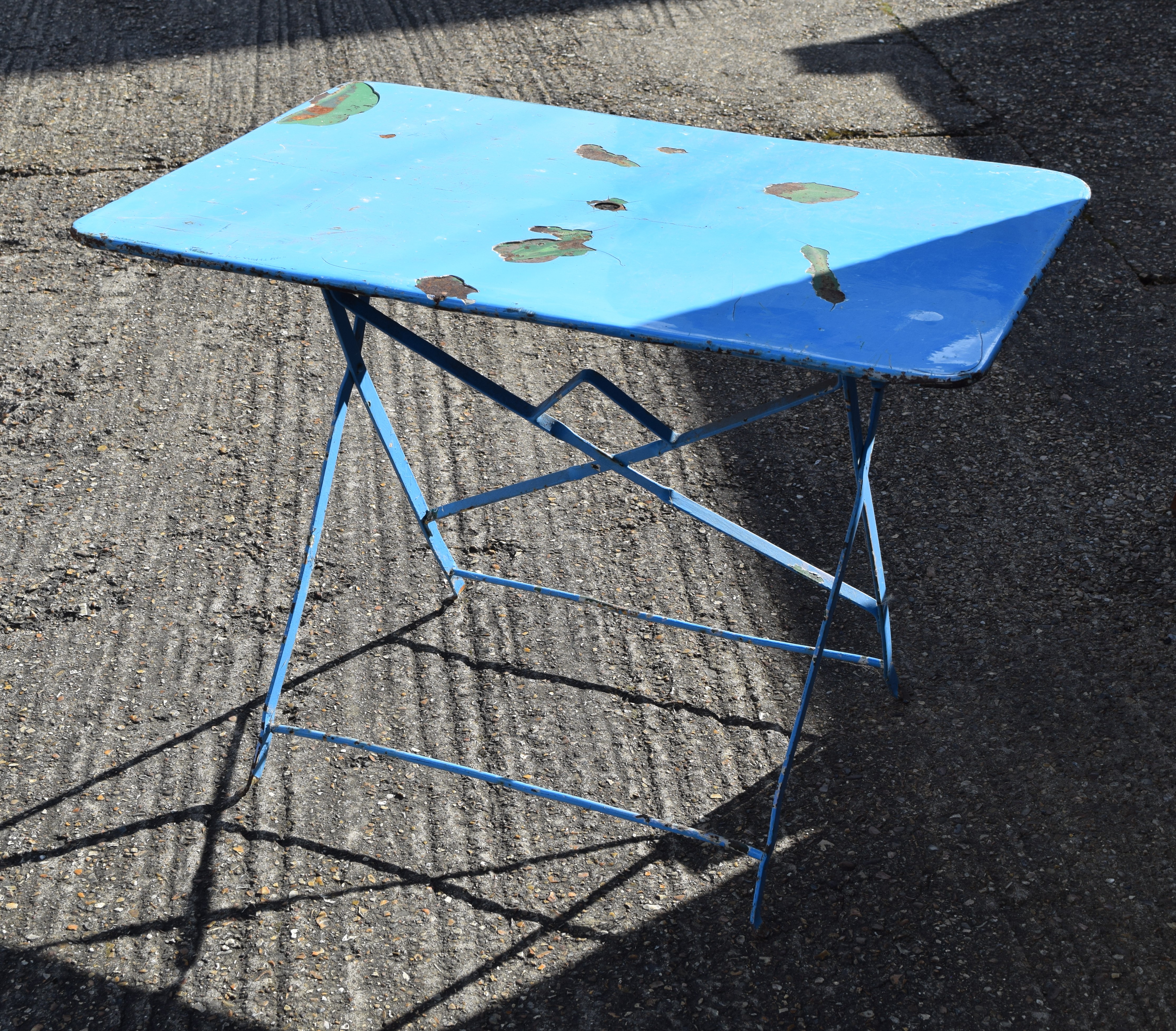 A French folding metal cafe table.