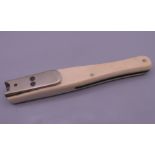 A Victorian ivory quill cutter. 10.25 cm long, closed.