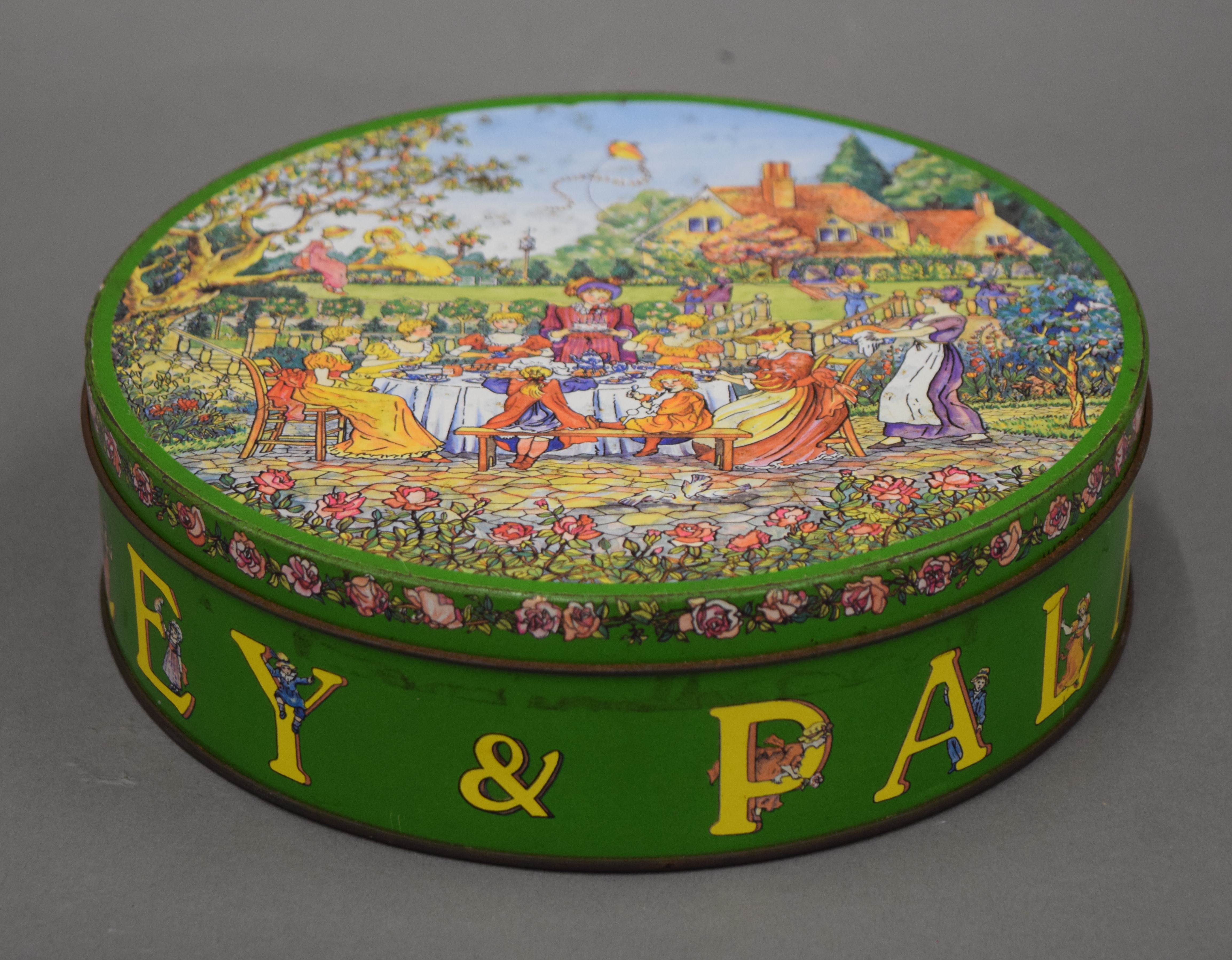 A Huntley and Palmers 'Rude' biscuit tin.