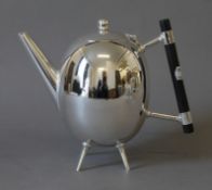 A Christopher Dresser style tea pot. 17.5 cm high.