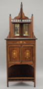 A Victorian inlaid rosewood corner cabinet. 172 cm high.