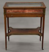 A 19th century brass mounted mahogany vitrine. 75 cm wide.