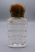 A 830 silver top glass perfume bottle. 8 cm high.