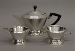 An Art Deco silver plated tea set. The tea pot 28 cm long.