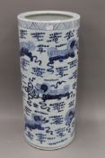 A Chinese pottery blue and white stick stand. 59 cm high.