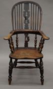 A Victorian elm seated Windsor chair. 64 cm wide.