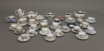 A collection of porcelain miniatures, including Royal Crown Derby, Wedgwood, etc.