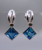 A pair of 18 ct white gold, diamond and topaz earrings. 2.5 cm high.