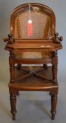 A Victorian mahogany child's high chair. 42.5 cm wide.