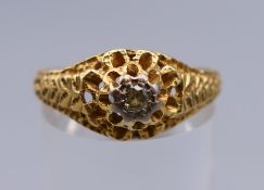 An 18 ct gold and diamond solitaire ring. Ring size Q/R. 3.7 grammes total weight.