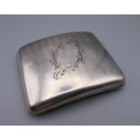 A silver cigarette case. 10.5 cm x 8.5 cm. 190.5 grammes total weight.