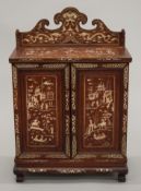 An early 20th century Chinese ivory and wooden inlaid table cabinet. 40.5 cm wide.