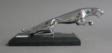 A leaping Jaguar desk weight. 21 cm long.