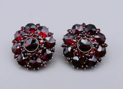 A pair of Victorian Bohemian garnet earrings fitted with 9 ct gold stems and clips.