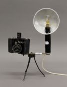 A Zeiss Ikon camera flash sideboard lamp. 38 cm high.