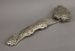 A Chinese silvered bronze ruyi sceptre. 35.5 cm long.