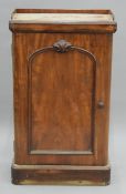 A Victorian mahogany side cupboard. 58 cm wide.