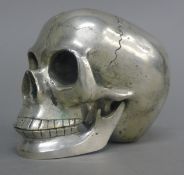 A silver plated model of a skull. 11.5 cm long.
