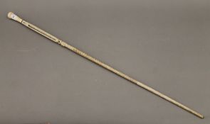 A 19th century ivory and marine ivory carved walking stick. 94 cm long.