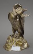 A silvered bronze inkwell formed as a bird of prey with a game bird in its beak. 20 cm high.