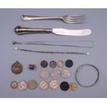 A quantity of various silver, including coins, knife and fork, St Christopher pendant, etc.