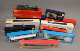 A large collection of OO gauge model trains, carriages and numerous accessories, buildings, etc.