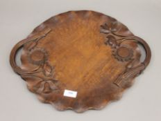 An Eastern carved wooden tray. 46.5 cm wide.