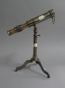 A small brass telescope and stand. 23 cm long.
