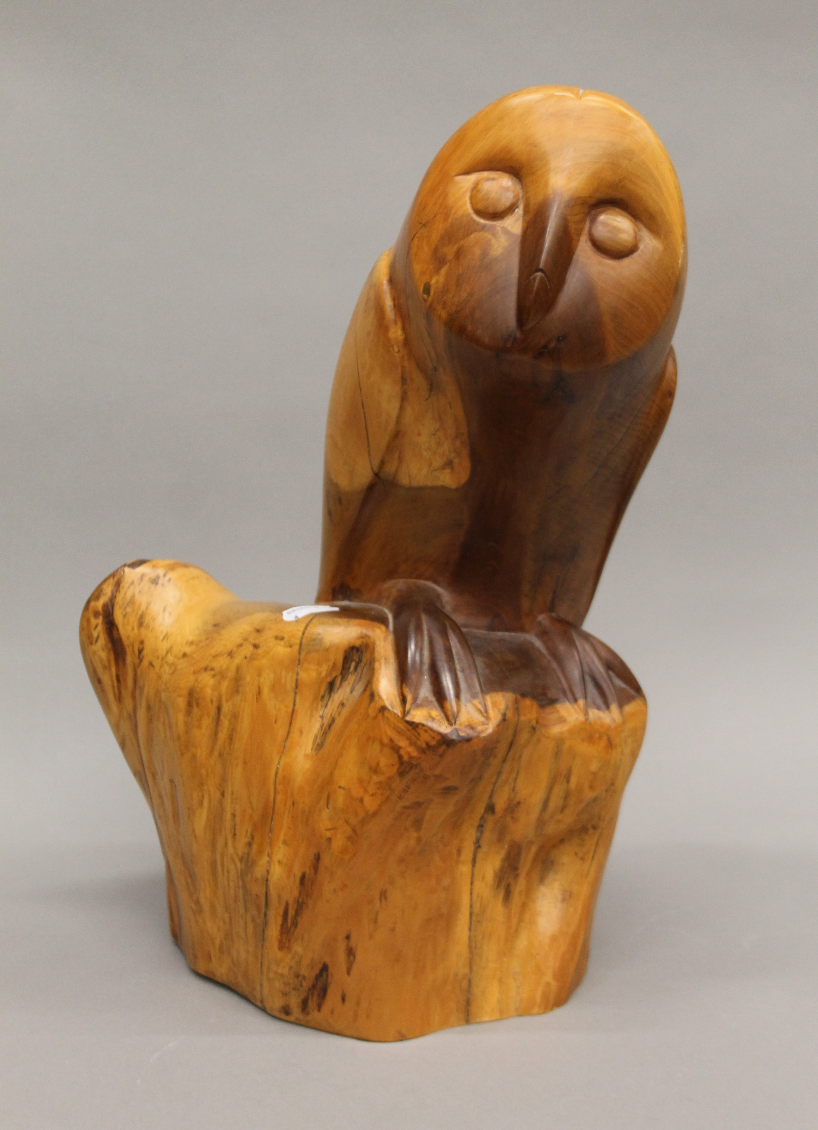 A carved wooden model of an owl. 40 cm high.