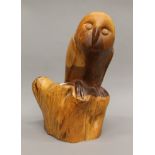 A carved wooden model of an owl. 40 cm high.