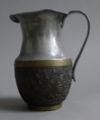 A Chinese metal mounted coconut jug. 12 cm high.