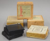A collection of various magic lantern slides, some boxed.
