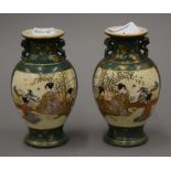 A pair of green Satsuma vases, signed to base. Approximately 13 cm high.