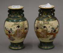 A pair of green Satsuma vases, signed to base. Approximately 13 cm high.