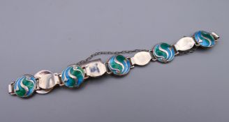 An Arts & Crafts silver and enamel bracelet by Stanton Brothers, Birmingham 1911.