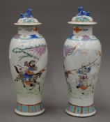 A pair of 19th century Chinese porcelain lidded vases. 33 cm high.