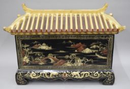 A 19th century chinoiserie lacquered pagoda casket and cover. 69 cm long.