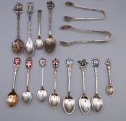 A quantity of silver and silver plate souvenir spoons and sugar nip/tongs. 75.