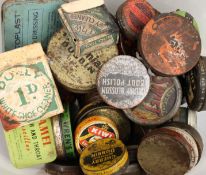 A collection of vintage shoe polish tins.