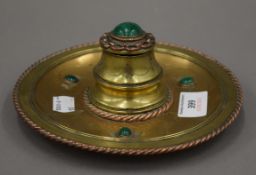 A Victorian brass and malachite inkwell. 17.5 cm diameter.