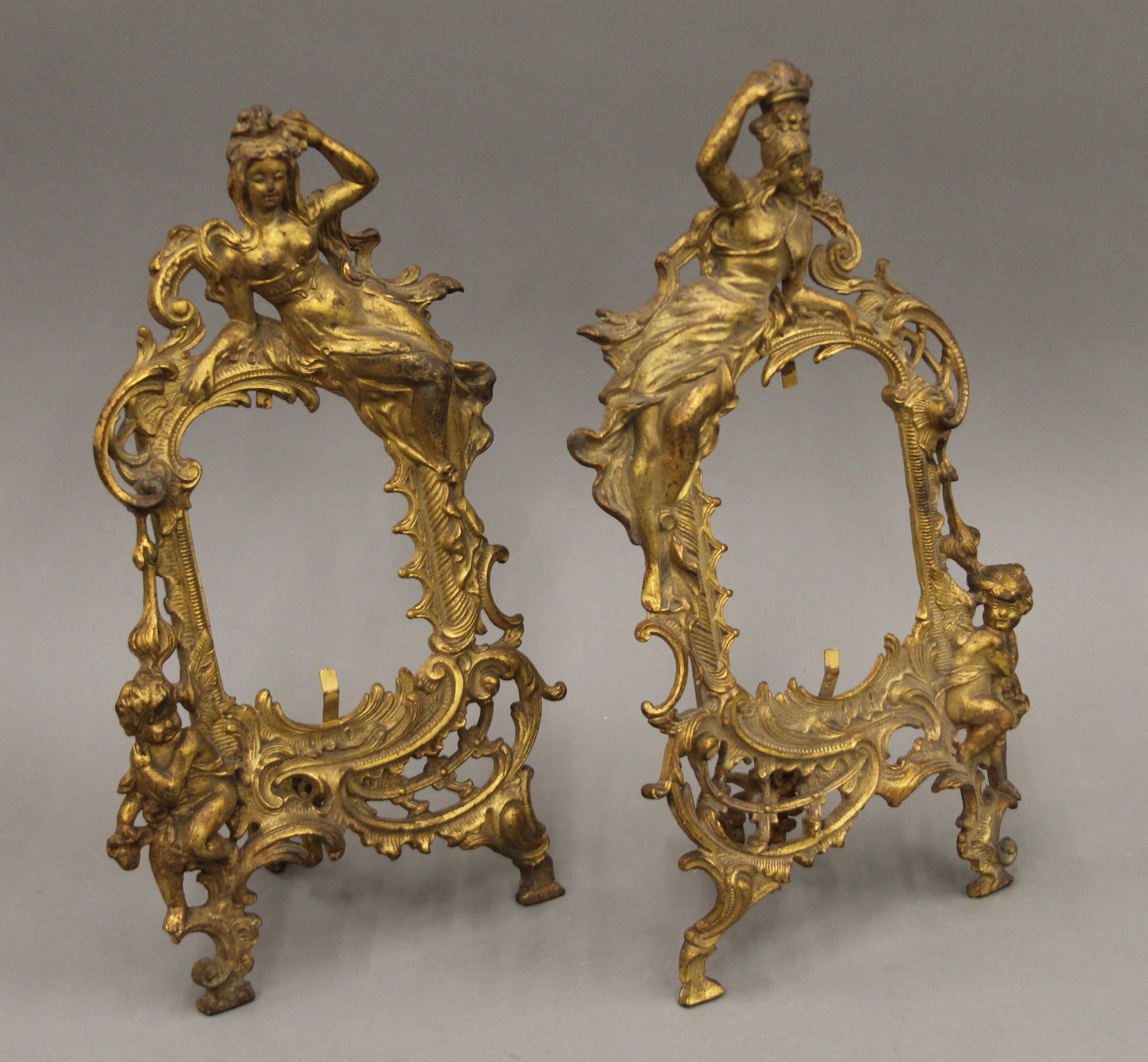 A pair of gilt metal frames. 33 cm high.