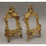 A pair of gilt metal frames. 33 cm high.