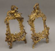 A pair of gilt metal frames. 33 cm high.