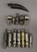 A collection of vintage whistles.