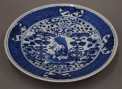 A Chinese blue and white porcelain plate with six character mark to base. 27.5 cm diameter.