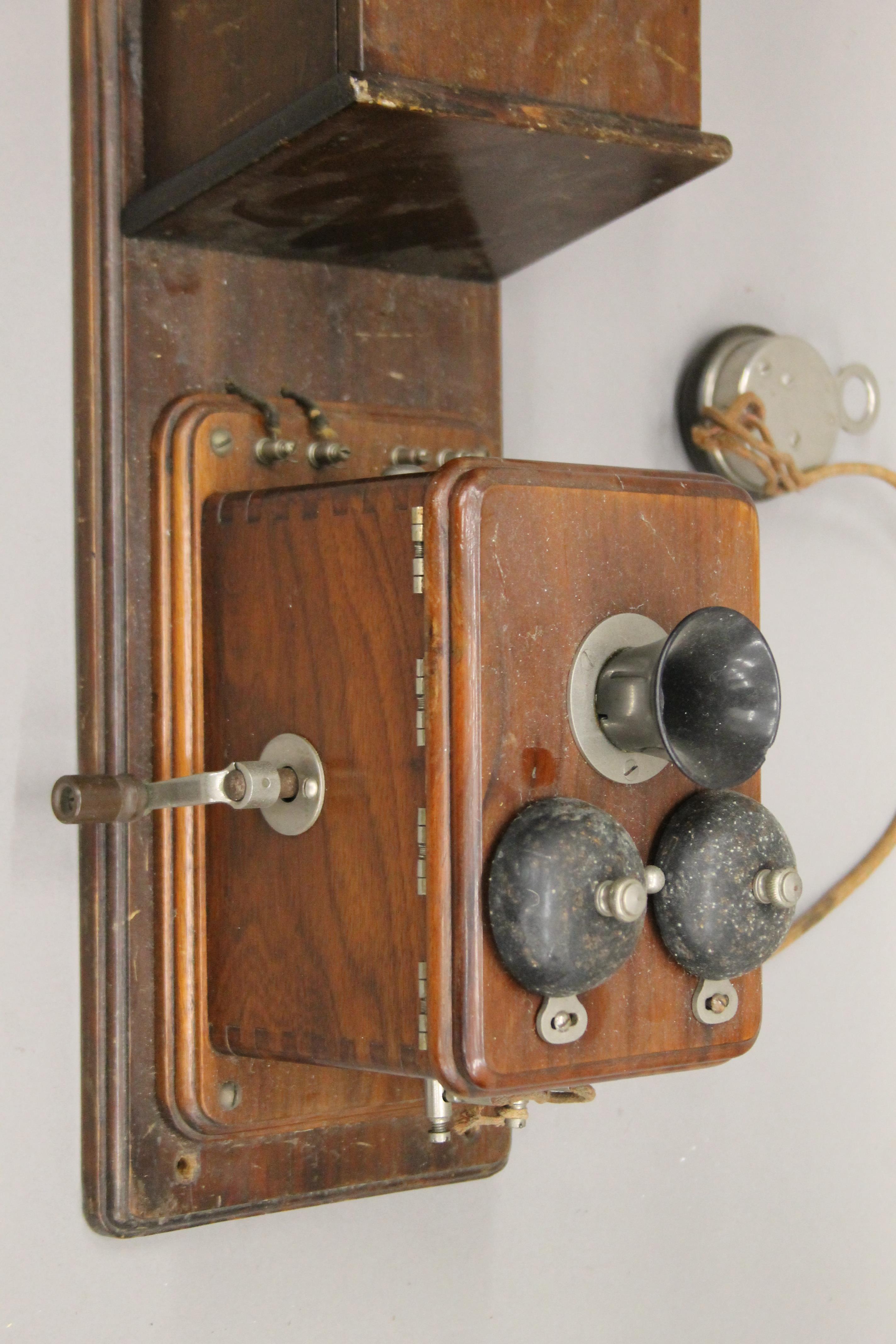 A vintage wooden wall mounted telephone. - Image 5 of 5